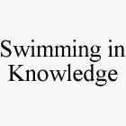 SWIMMING IN KNOWLEDGE