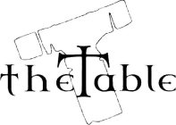 T THE TABLE