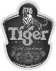 TIGER SINCE 1932 WORLD ACCLAIMED BREWING SINCE 1932, LONDON GENEVA, BILA 1998-99 AWARD WINNING, THE BRITISH BOTTLES INSTITUTE AND LAGERING