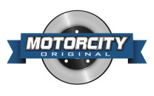 MOTORCITY ORIGINAL, RIBBON ON TOP OF ROUND SHAPE CIRCLES WITH 3 SMALL ROUND DOTS INSIDE THE SMALLER CIRCLE BENEATH THE RIBBON SHAPE DESIGN