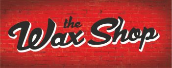 THE WAX SHOP IN BLACK ITALICIZED LETTERS OVER A RED BRICK WALL