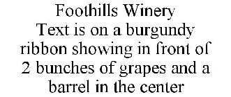 FOOTHILLS WINERY TEXT IS ON A BURGUNDY RIBBON SHOWING IN FRONT OF 2 BUNCHES OF GRAPES AND A BARREL IN THE CENTER