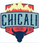 THE WORDING CHICALI IN NAVY BLUE IN A TEAL BANNER, THE WORDING EST. TACOS 2014 IN NAVY BLUE IN A RED SHIELD SEPARATED BY NAVY BLUE BULL HEAD